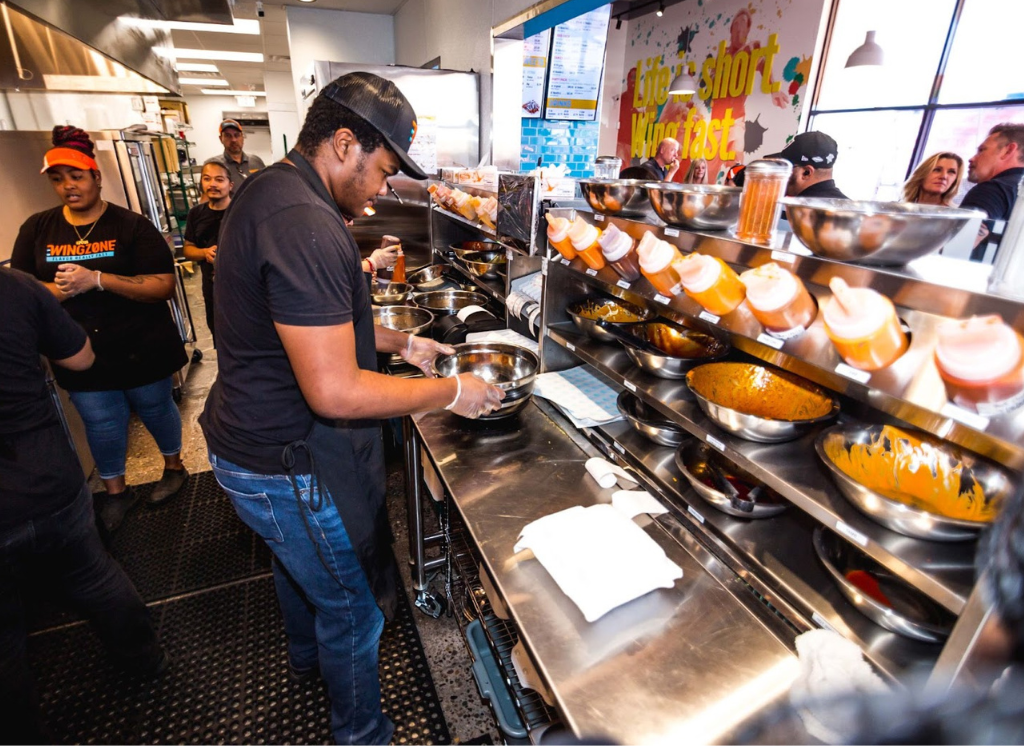 Wing Zone employees working 